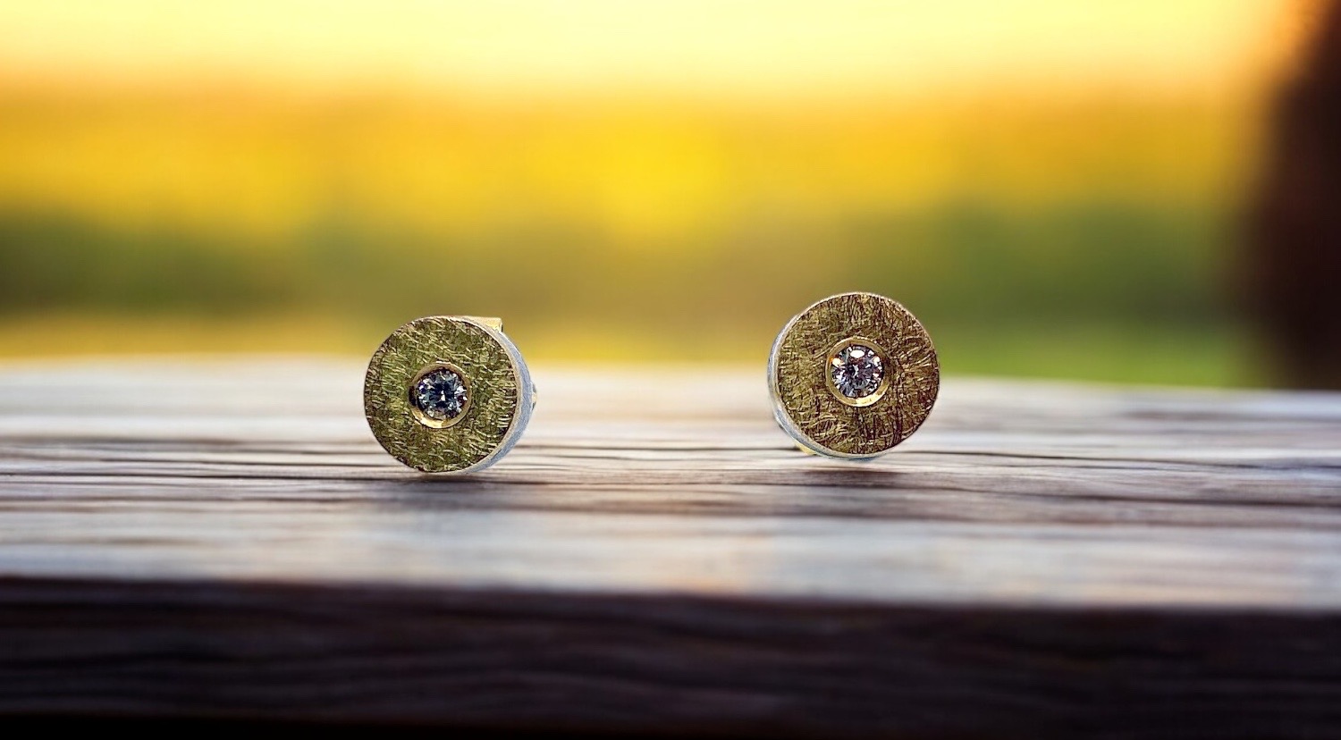 round earrings with diamonds in silver and gold