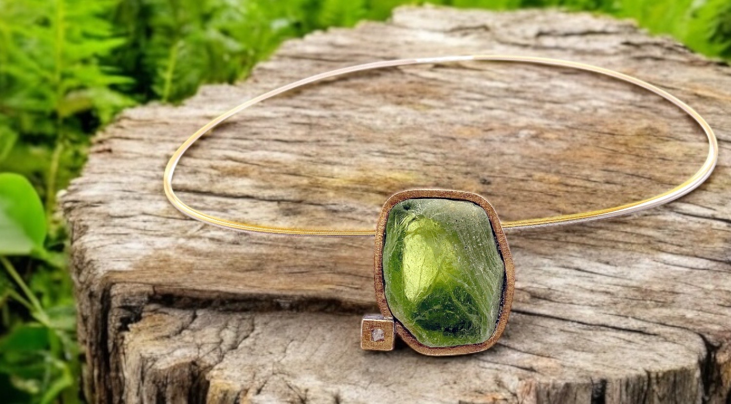 rectangular rough peridot pendant with rough diamond in silver and gold