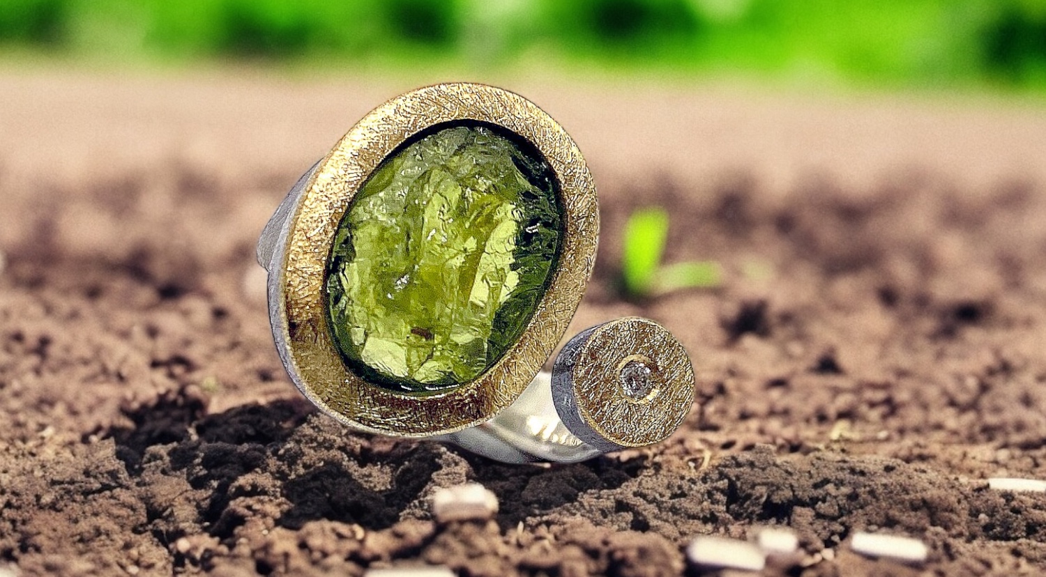 oval rough peridot ring with diamond in silver and gold
