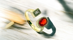 OVAL MEXICAN FIRE OPAL RING WITH TWO DIAMONDS IN GOLD