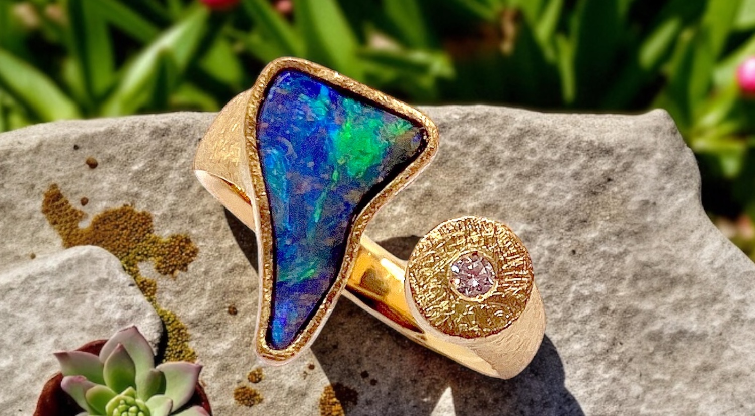 triangular australian boulder opal ring with diamond in gold