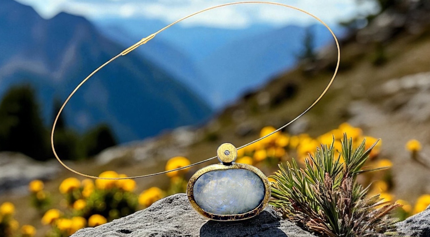 rough oval moonstone pendant with diamond in silver and gold