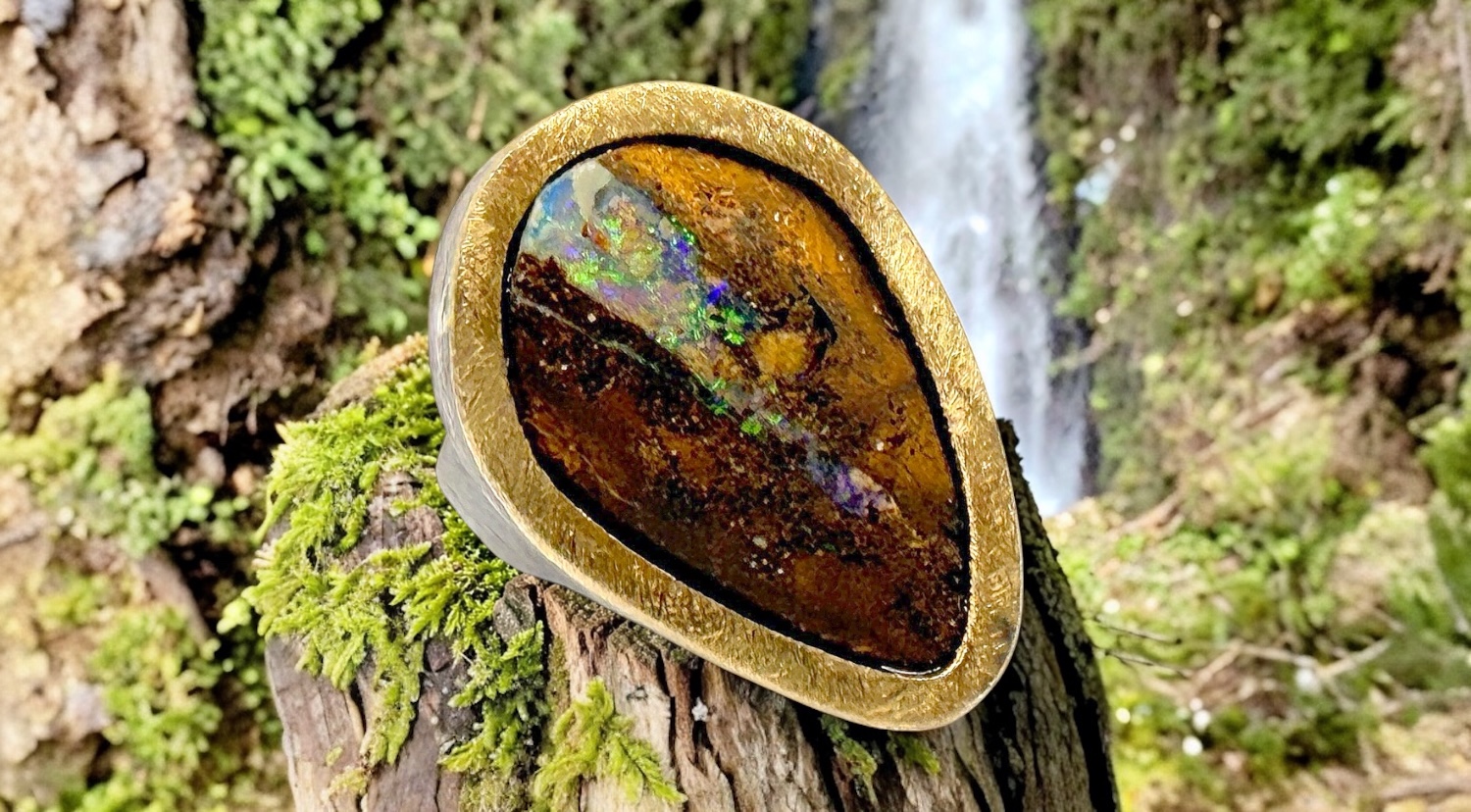 triangular australian boulder opal ring in silver and gold