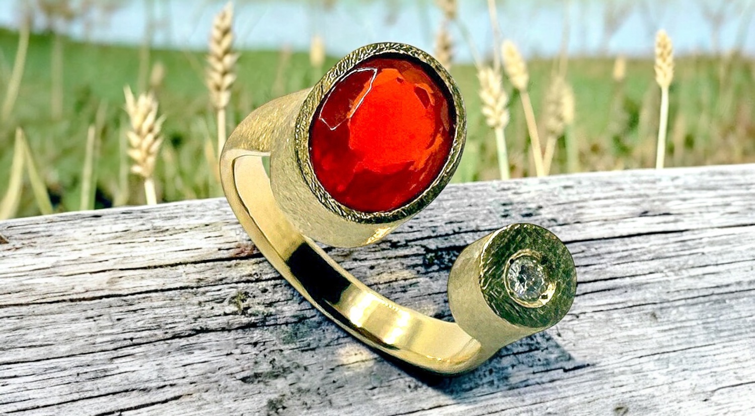 oval mexican fire opal with diamond in gold