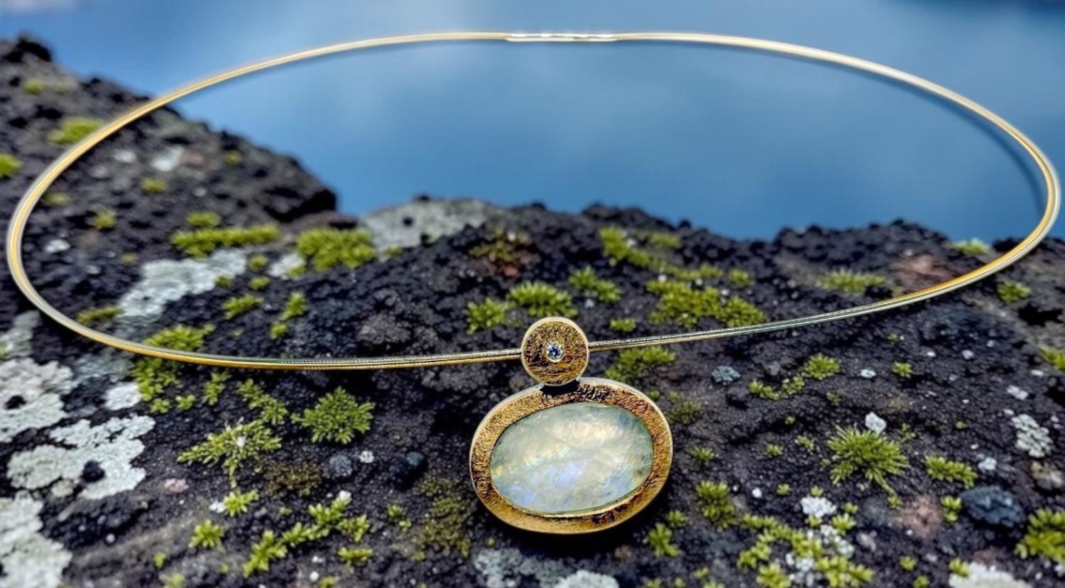 oval rough moonstone pendant with diamond in silver and gold