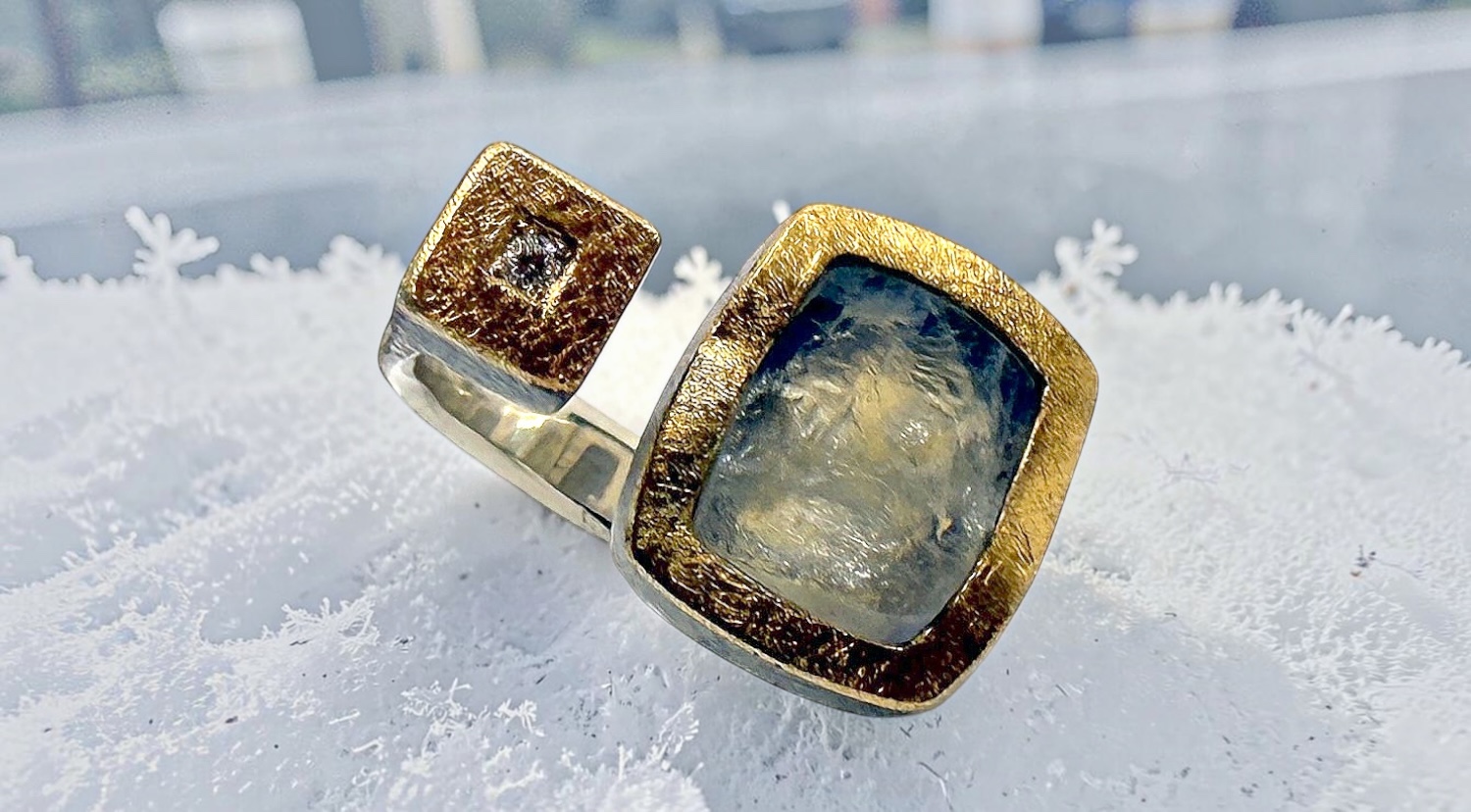 rectngular rough moonstone ring with diamond in silver and gold