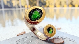 OVAL ROUGH TSAVORITE AND FACETED ROUND TSAVORITE RING IN SILVER AND GOLD