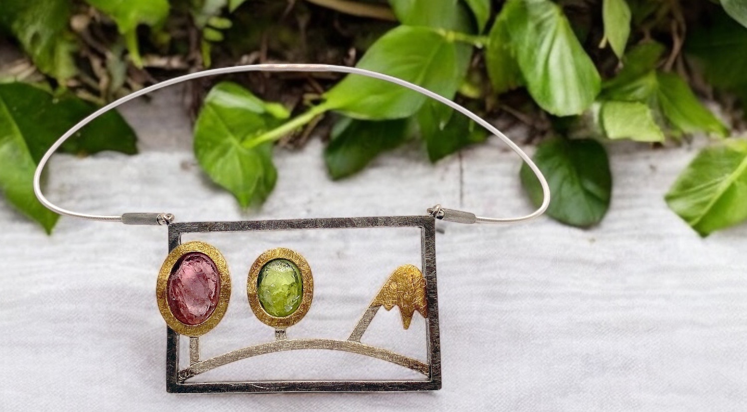 pendant mountain landscapes in autumn olivine and pink tourmaline in rough silver and gold